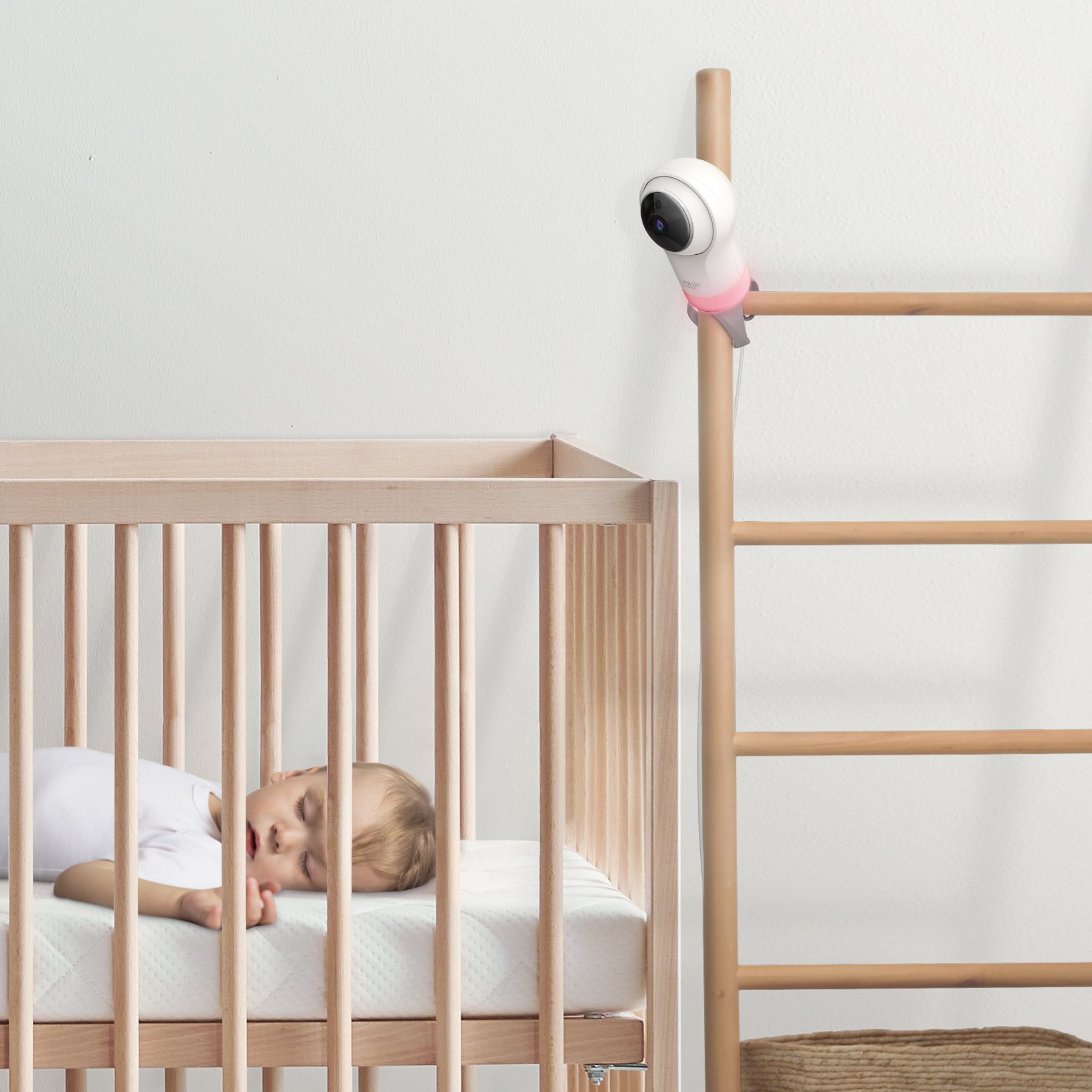 Baby camera mounted beside a crib